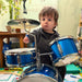 Child playing a blue drum set with an EaZyHold Grip Aid