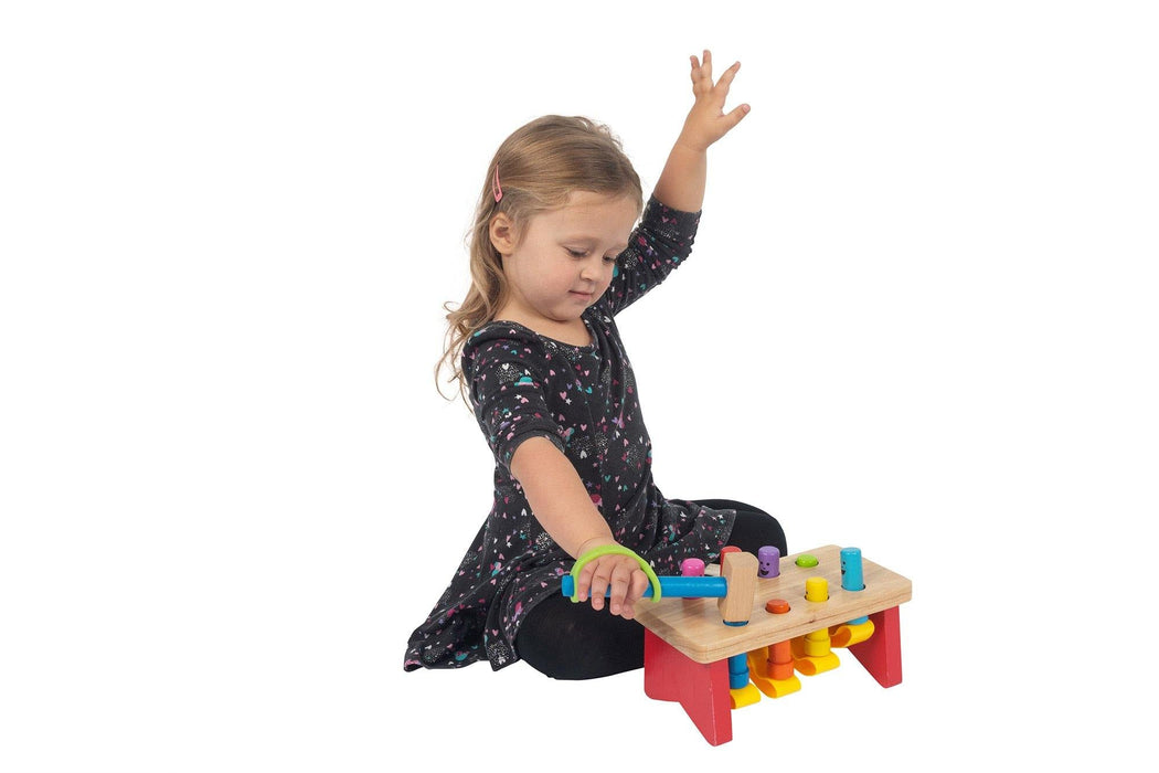 Child playing with a colorful wooden toy holding with a green EaZyHold Grip Aid on a white background