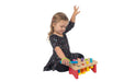 Child playing with a colorful wooden toy holding with a green EaZyHold Grip Aid on a white background