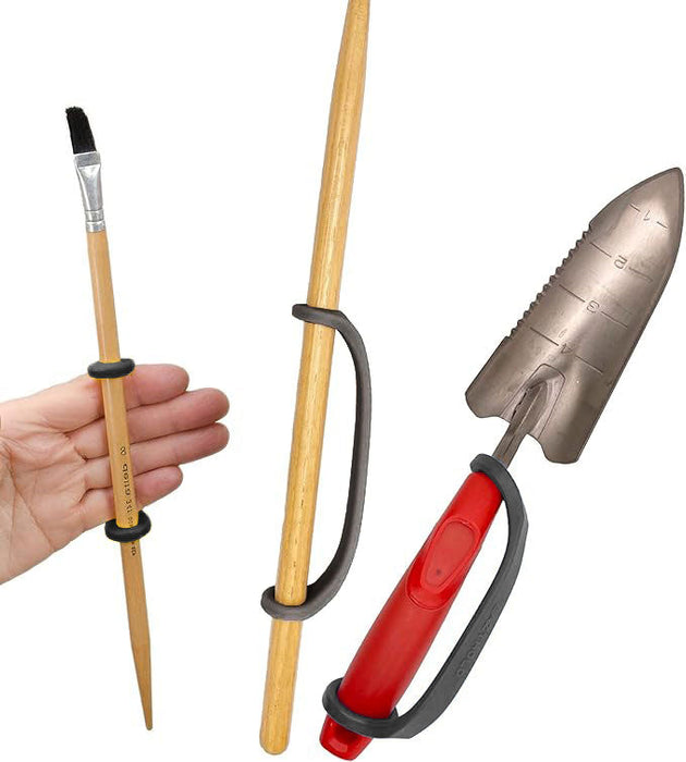 Set of gardening tools including a trowel, pruner, and brush with a black EaZyHold Grip Aid on a white background