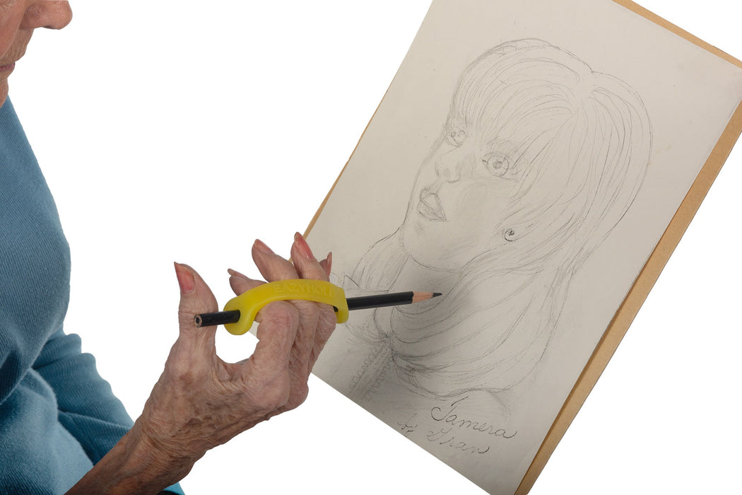 Person holding a pencil with an EaZyHold Grip Aid, drawing a portrait on a piece of paper