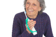 Woman holding a toothbrush with an EaZyHold Grid Aid on a white background