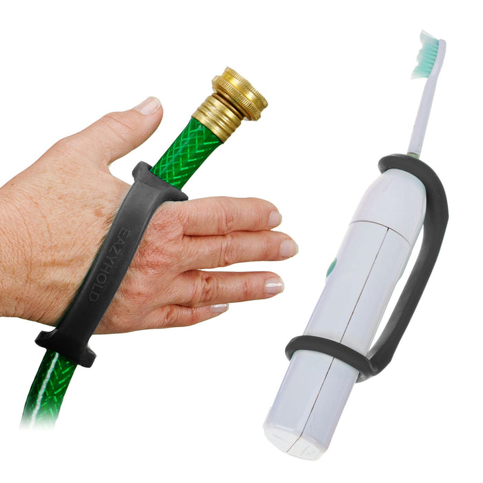 White toothbrush and hand holding a garden hose with a black EaZyHold Grip Aid on a white background