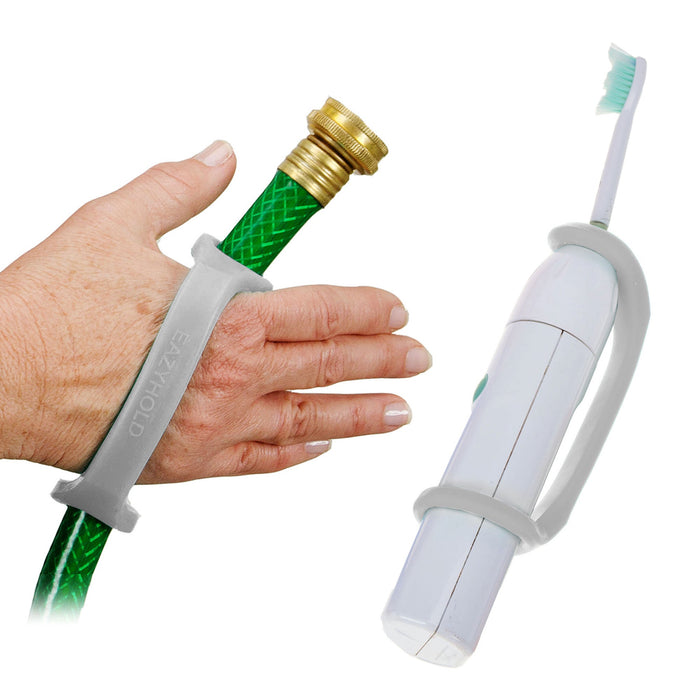 White toothbrush and hand holding a garden hose with a platinum EaZyHold Grip Aid on a white background