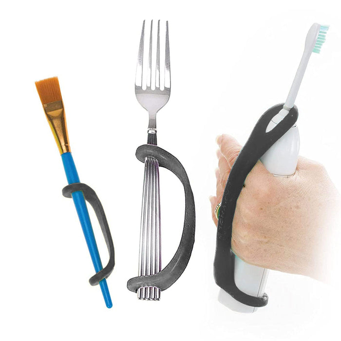 Fork, paintbrush, and toothbrush with EaZyHold Grip Aid on a white background