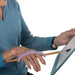 Person using a paint brush with a lavendarngreen EaZyHold Grip Aid on a white background