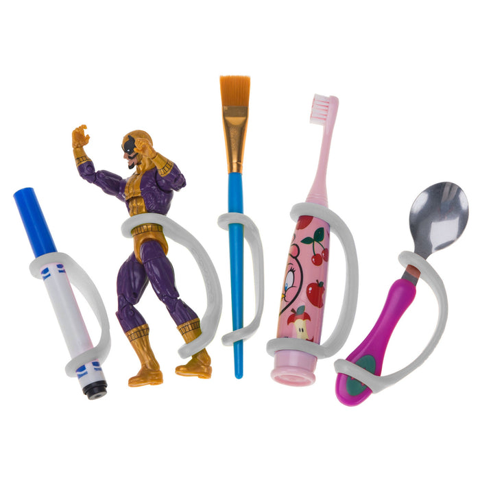 Colorful children's utensils and toys including a brush, action figure, toothbrush, spoon, and marker with a platinum EaZyHold Grip Aid holding each item on a white background 