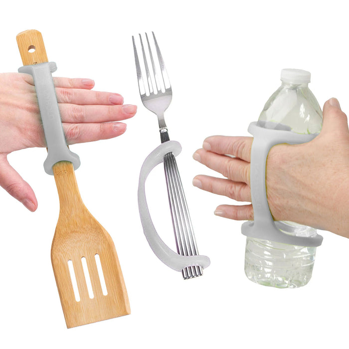 Hands holding a spatula, fork, and water bottle with a platinum EaZyHold Grid Aid on a white background