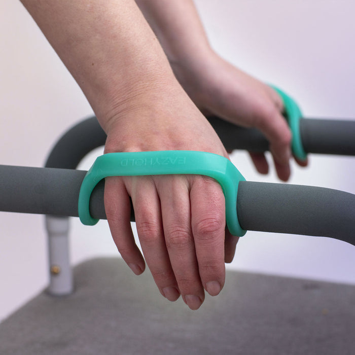 Person using an EaZyHold Grid Aid on a bar for support