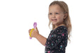 Child holding a purple spoon with a yellow EaZyHold Grip Aid on a white background