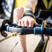 Front detail of Equip Products Rowing Hook in use on a rowing machine by an athlete with an left above the elbow amputation.