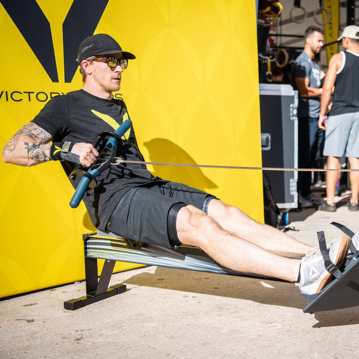 Equip Products Rowing Hook in use on a rowing machine by an athlete with an left above the elbow amputation.