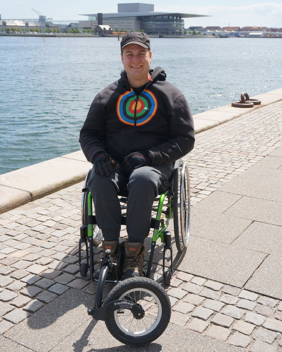 FreeWheel Wheelchair Attachment user along the water