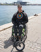 FreeWheel Wheelchair Attachment user along the water