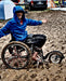 FreeWheel Wheelchair Attachment user in the mud.