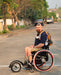 FreeWheel Wheelchair Attachment user in Thailand.