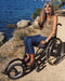 FreeWheel Wheelchair Attachment user along the water.
