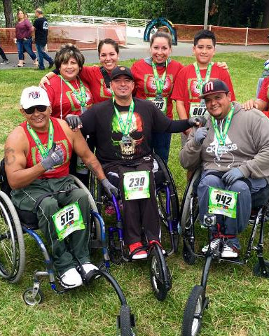 Group of FreeWheel Wheelchair Attachment users in a half marathon.