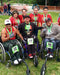 Group of FreeWheel Wheelchair Attachment users in a half marathon.