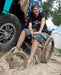 FreeWheel Wheelchair Attachment user with mud covering their device.