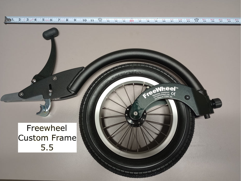 FreeWheel Wheelchair Attachment Black Size 5.5" against a tape measure.