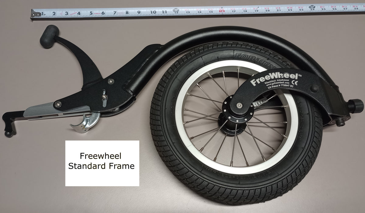FreeWheel Wheelchair Attachment Black Size 4.5" against a tape measure.