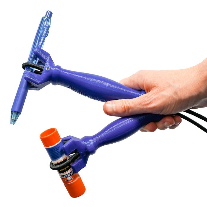 Hand holding the functionalhand & functionalhand mini Universal Cuff Grip Aids with a marker & glue stick being held on each on a white background