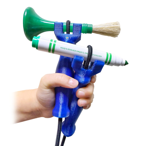 Hand holding two functionalhand mini Kids' Universal Cuff Grip Aids with a marker & paint brush being held on each on a white background