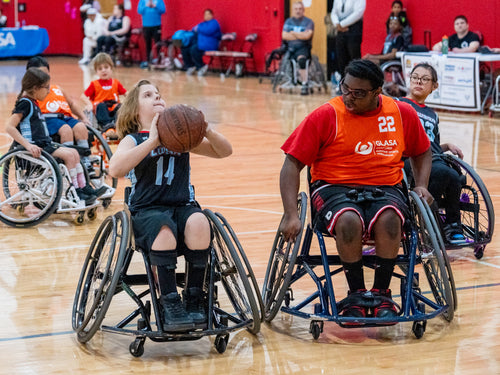 GLASA Athletes playing in a wheelchair basketball game.