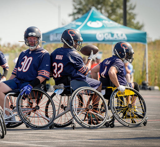 Chicago Bears Wheelchair Football team getting ready to run a play.