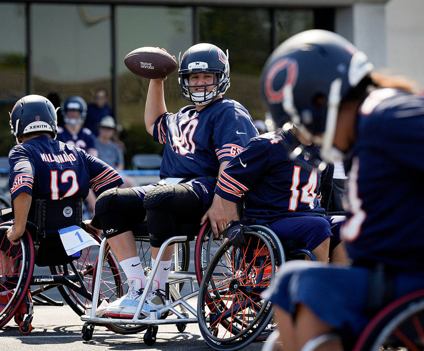 GLASA Chicago Bears Wheelchair Football quarter back getting ready to pass to the wide receiver 