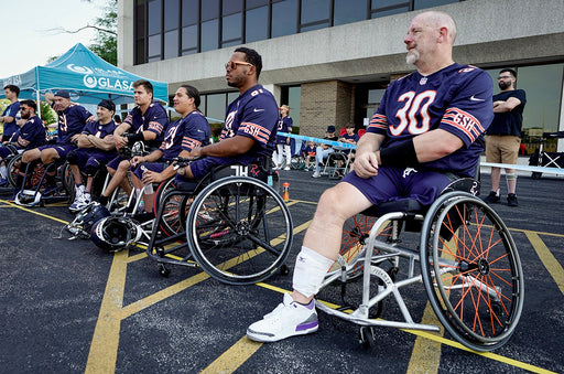 Chicago Bears Wheelchair Football team on the sideline.