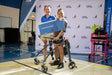 Athlete holding a certificate from The Hartford at the Great Lakes Games.
