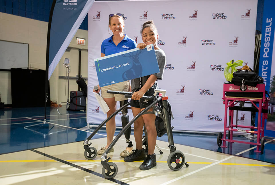 Athlete holding a certificate from The Hartford at the Great Lakes Games.