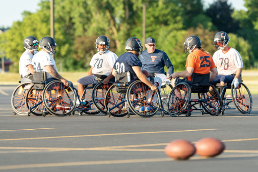 Group of GLASA Chicago Bears Wheelchair Football athletes at practice.