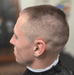 Man with a styled haircut in a barbershop setting