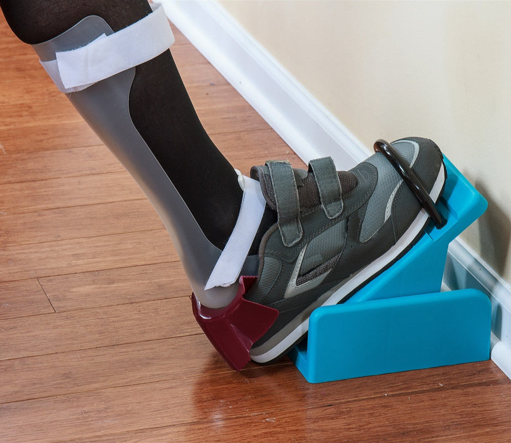 AFO Assist Shoe Platform with a white AFO on against a wall