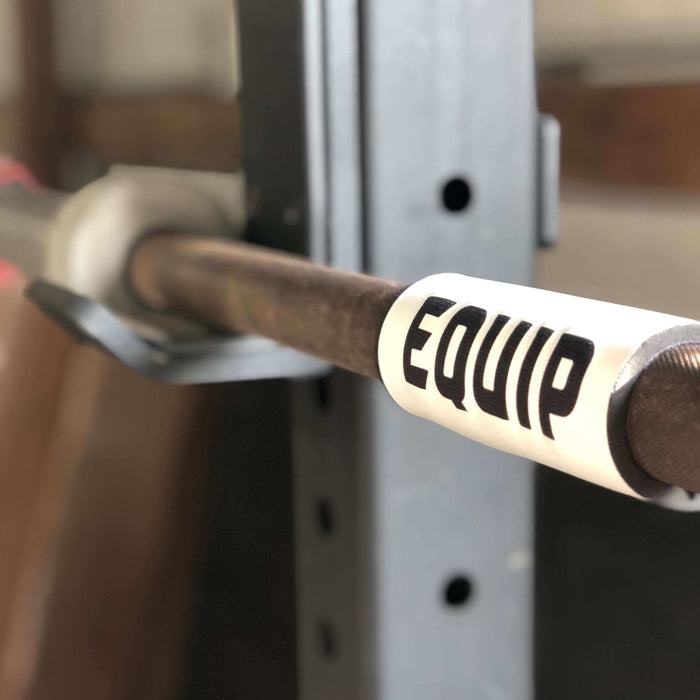 Side detail of Equip Products Barbell Markers for Visually Impaired in use on a barbell.