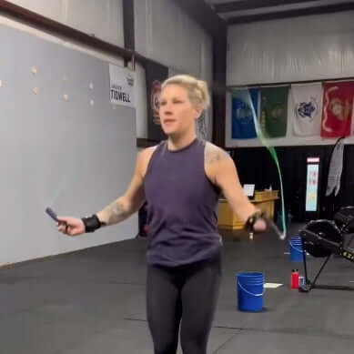 Equip Products Arm Cuff Jump Rope in use in the gym by an athlete with a left wrist amputation.