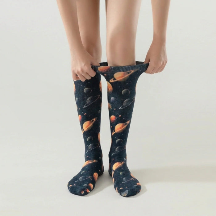 Lairos Deep Galaxy Kids' AFO Socks worn on model as they stretch the collar on a white background
