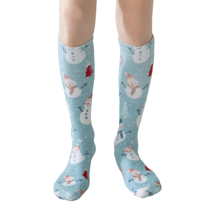 Lairos Frosted Snowman Kids' AFO Socks worn on model on a white background