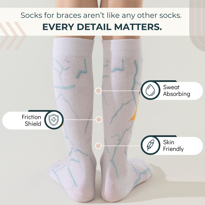 Lairos Mighty Steps Kids' AFO Socks back worn on model on a white background. Text on image: Socks for braces aren't like any other socks. Every detail matters. Sweat Absorbing. Friction Shield. Skin Friendly.