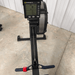 Equip Products Left Neglect Red Straps attached to a Concept2 rowing bar.