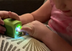 Young girl using Lil Nipper adaptive nail clipper by ClipDifferent