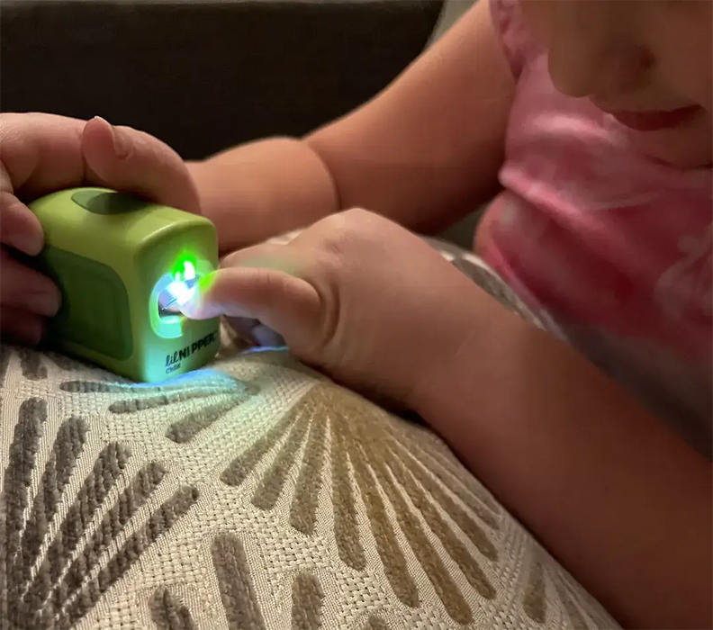 Young girl using ClipDifferent POD child size nail clipper