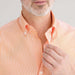MagnaReady Short Sleeve Orange and White Gingham Cotton Shirt with Magnetic Closures - worn by man with adaptive needs
