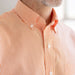 MagnaReady Short Sleeve Orange and White Gingham Cotton Shirt with Magnetic Closures - worn by man with adaptive needs