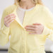 MagnaReady Women's Yellow Adaptive Magnetic Knit Cardigan Sweater - detail view of magnetic fasteners