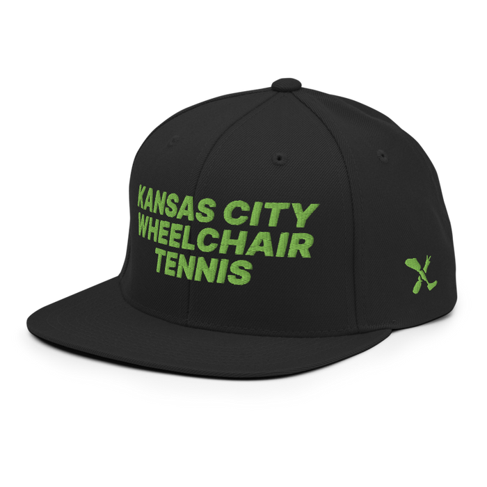 Front left angle of the MAS Kansas City Advantage Wheelchair Tennis Black Flat Bill Snapback against a white background