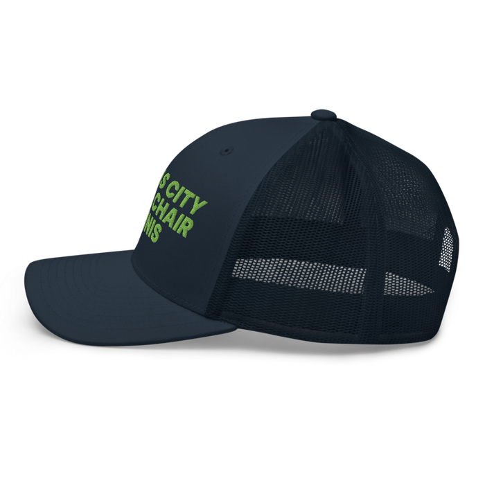 Left angle of the MAS Kansas City Advantage Wheelchair Tennis Navy Curved Bill Trucker Snapback against a white background
